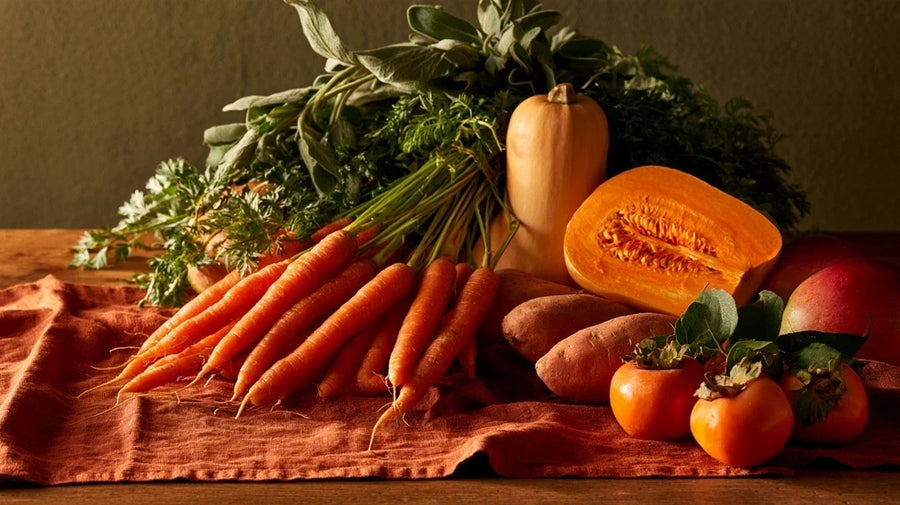Still life of carrots, squash, sweet potato and mango, representing orange poo causes | Gutsi